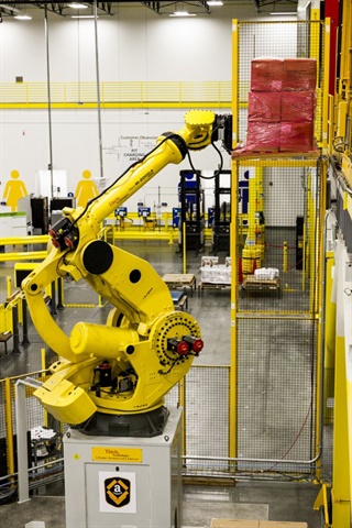 Robots and information technology are transforming the way warehouses and fulfillment centers work. Photo: Amazon