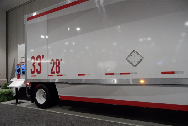 A pair of 33-foot pups would have 10 feet more floor space for cargo than a set of 28s, as the labels on this concept trailer show. And two 33s would have 13 more feet than a single 53-foot van. Will truckload shippers demand their use?  Photo: Tom Berg